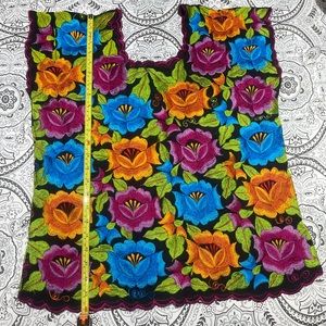 Hand embroidered Hand made floral blouse .